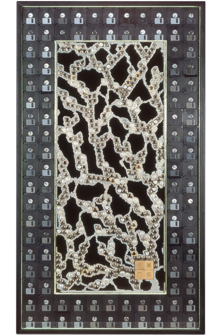 Artwork named "Teraflop" : cybertrash wall sculpture by Rémy Tassou. Main view.